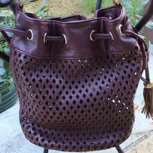 Francesco’s. Perforated merlot faux leather purse